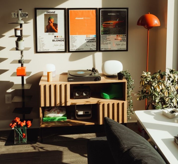 Walnut record console and orange floor lamp in afternoon sunlight